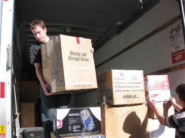 Two Leicester movers unloading a van