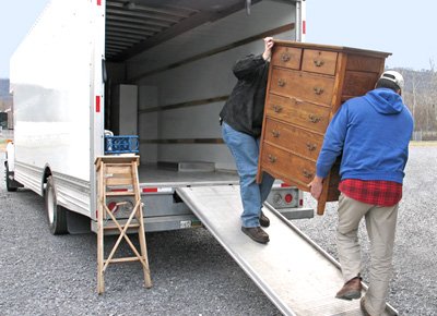 Two men loading a van in Leicester